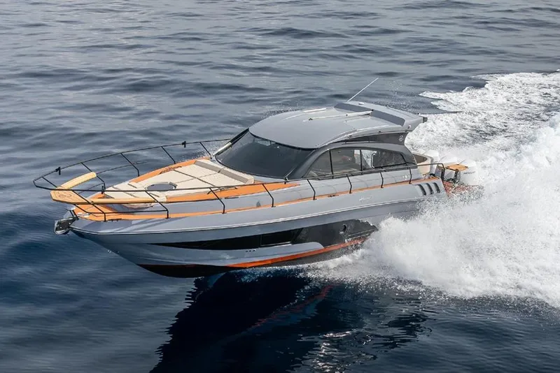The Image of 2026 Hanover 415 Outboard cruising on open water, showcasing sleek design and performance. - 0