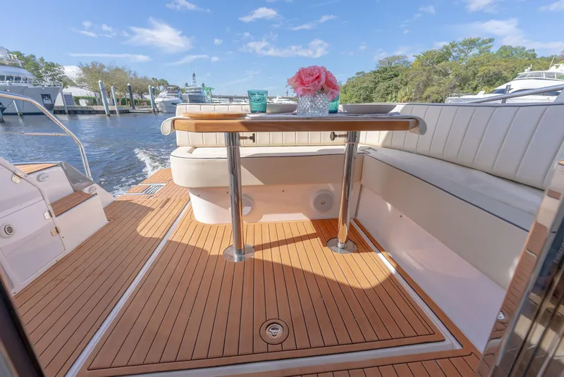 Slide: The Image of Luxurious Hanover 415 yacht deck with elegant seating and table, 2025 model. - 21