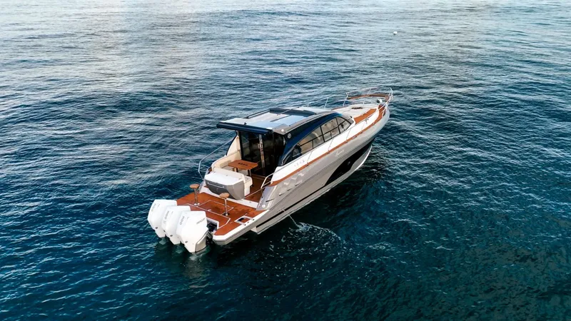 Slide: The Image of 2025 Hanover 415 yacht cruising on open water, showcasing sleek design and powerful engines. - 3