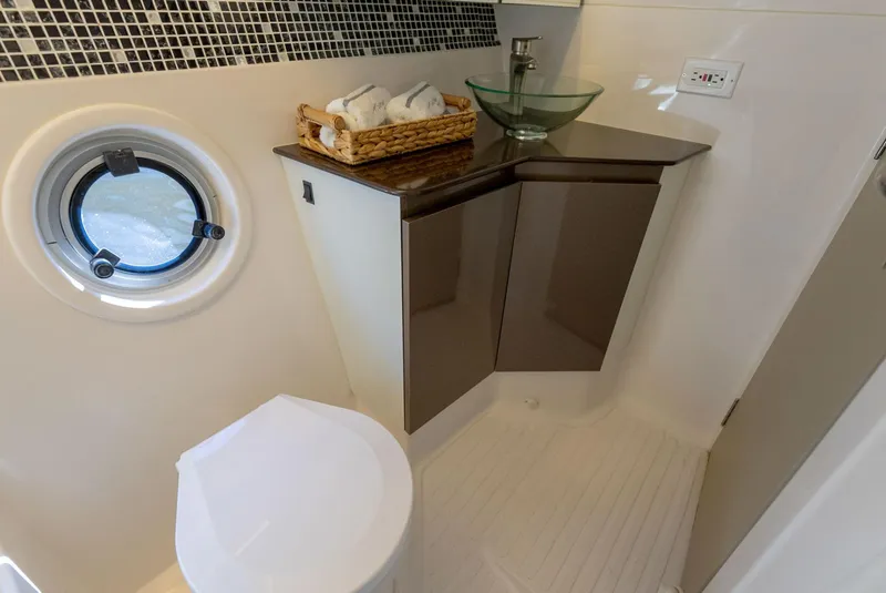 Slide: The Image of Modern bathroom in Hanover 415 yacht, featuring sleek design and glass sink, 2025 model. - 34