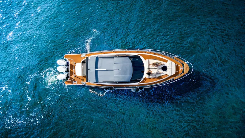 Slide: The Image of Aerial view of 2025 Hanover 415 yacht cruising on blue ocean waters. - 6