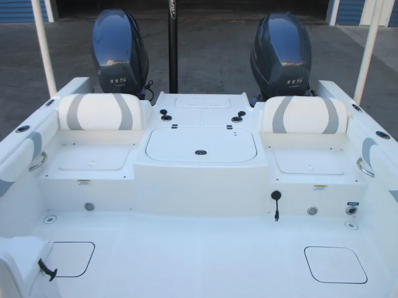 Slide: The Image of 2013 Carolina Cat 230 DC boat with dual engines and spacious seating area. - 13
