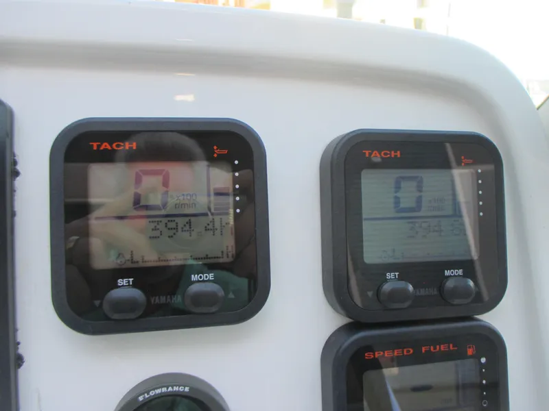 Slide: The Image of Dashboard of a 2013 Carolina Cat 230 DC with Yamaha tachometers and speed fuel gauges. - 18