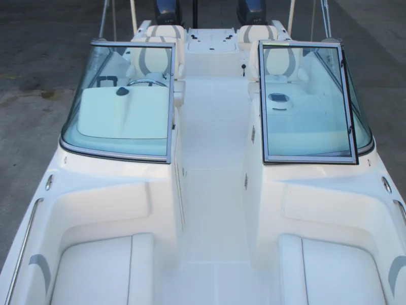 Slide: The Image of 2013 Carolina Cat 230 DC boat interior with dual consoles and seating. - 21