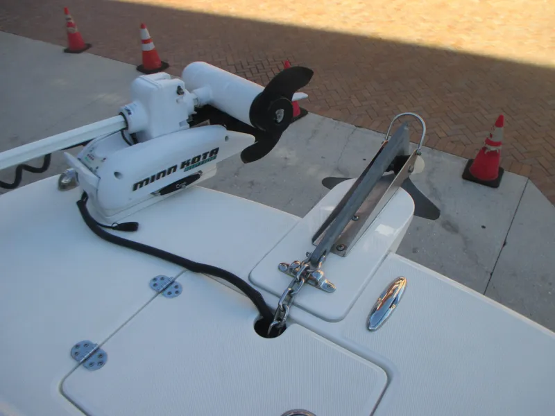 Slide: The Image of 2013 Carolina Cat 230 DC boat with Minn Kota trolling motor on deck. - 22