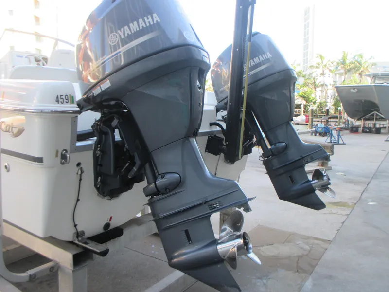 Slide: The Image of Twin Yamaha outboard motors on a 2013 Carolina Cat 230 DC boat, dockside view. - 7