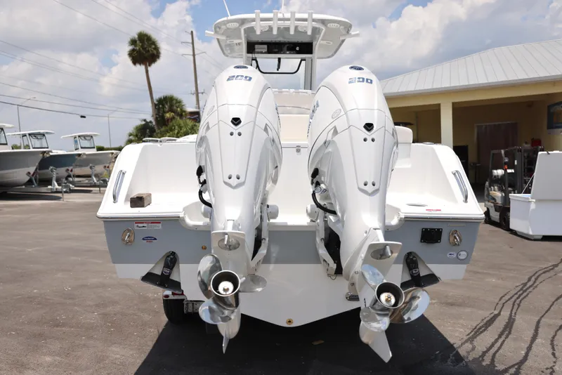 Slide: The Image of 2025 Sea Hunt Gamefish 27 Forward Seating boat with twin outboard engines. - 10