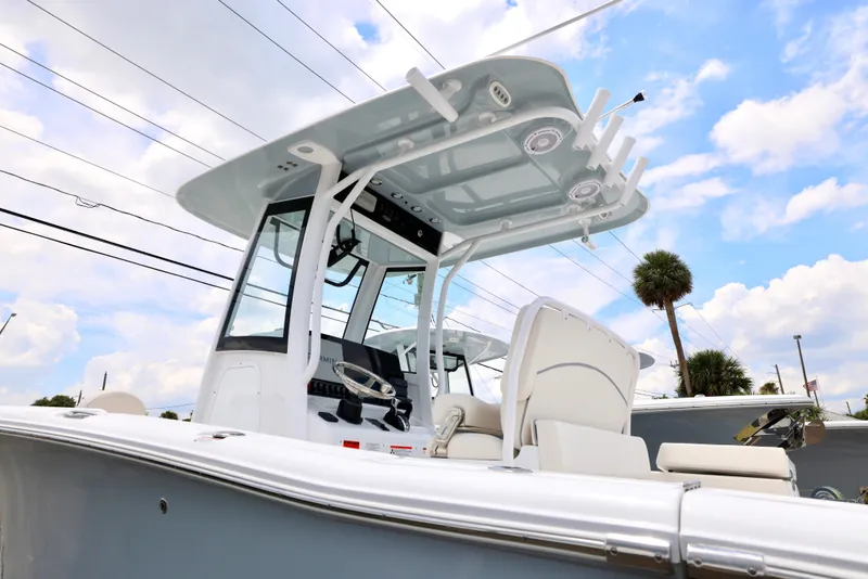 Slide: The Image of 2025 Sea Hunt Gamefish 27 Forward Seating boat with T-top and console. - 11