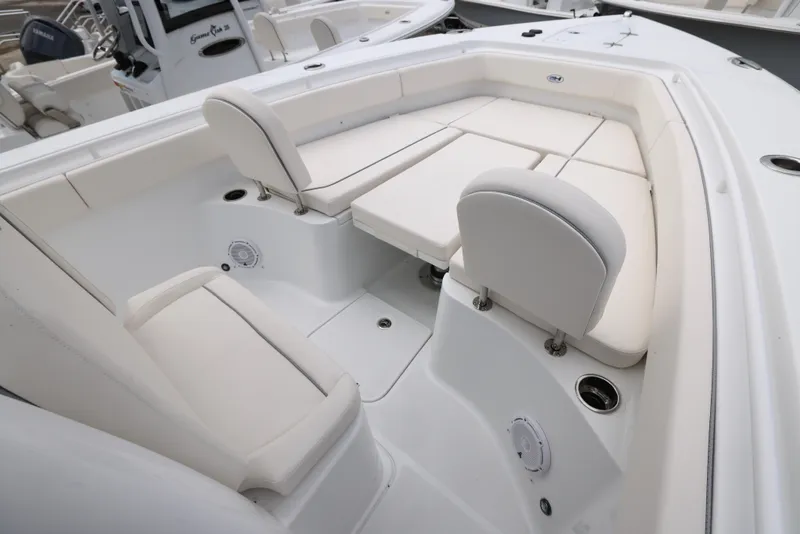 Slide: The Image of 2025 Sea Hunt Gamefish 27 Forward Seating, white cushioned seats, spacious layout. - 12