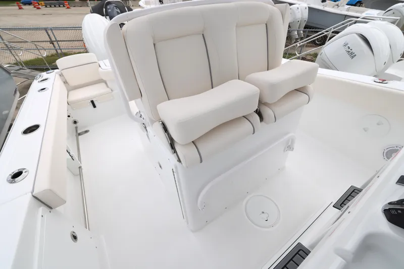 Slide: The Image of 2025 Sea Hunt Gamefish 27 Forward Seating boat interior with plush white seats. - 18