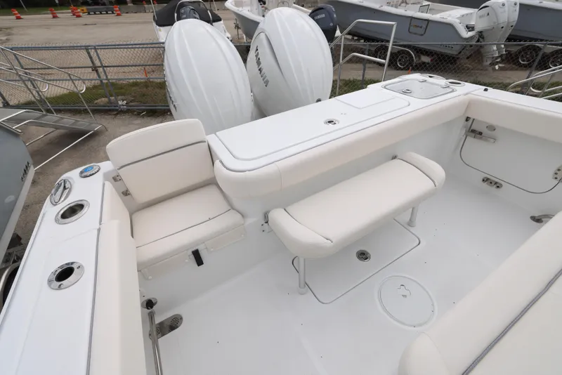 Slide: The Image of 2025 Sea Hunt Gamefish 27 Forward Seating boat interior with dual outboard engines. - 21