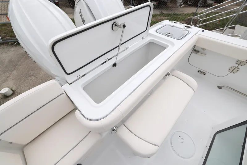 Slide: The Image of 2025 Sea Hunt Gamefish 27 Forward Seating boat with open storage compartment. - 24