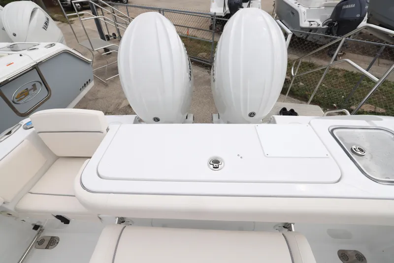 Slide: The Image of 2025 Sea Hunt Gamefish 27 Forward Seating boat with dual outboard engines. - 25