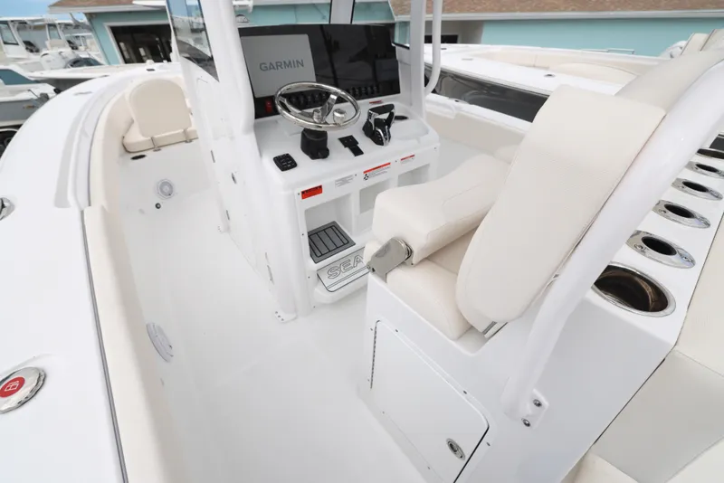 Slide: The Image of 2025 Sea Hunt Gamefish 27 Forward Seating boat cockpit with Garmin navigation system. - 27