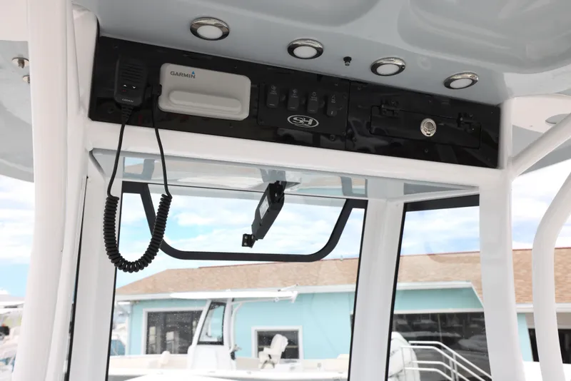 Slide: The Image of 2025 Sea Hunt Gamefish 27 Forward Seating helm electronics and controls. - 28