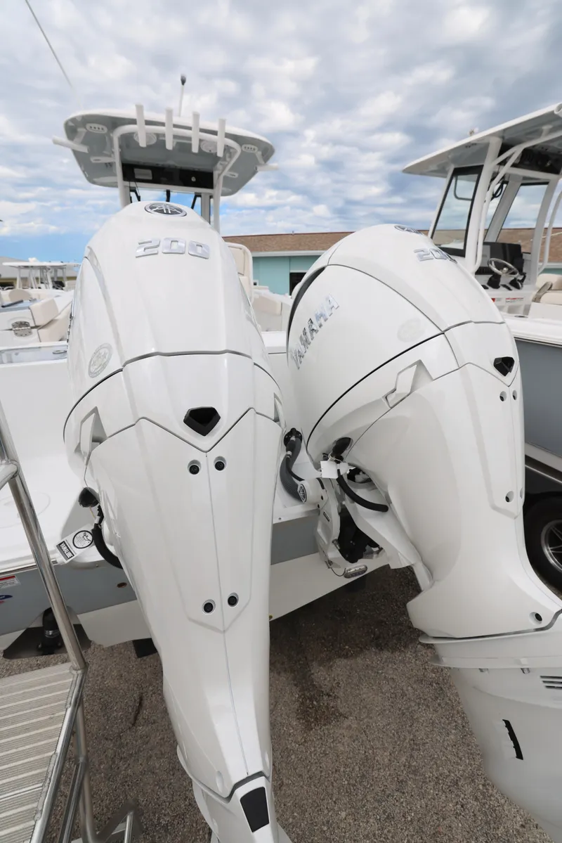 Slide: The Image of 2025 Sea Hunt Gamefish 27 Forward Seating with twin outboard engines. - 32