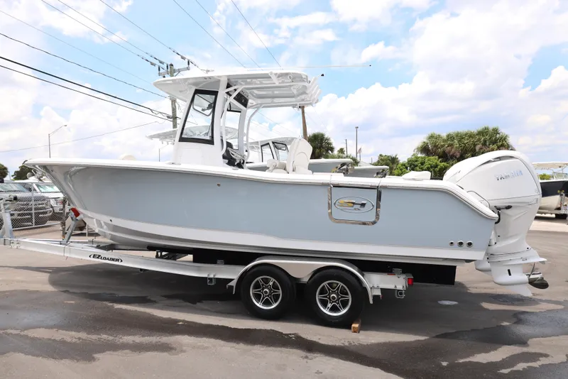 Slide: The Image of 2025 Sea Hunt Gamefish 27 Forward Seating boat on trailer. - 33