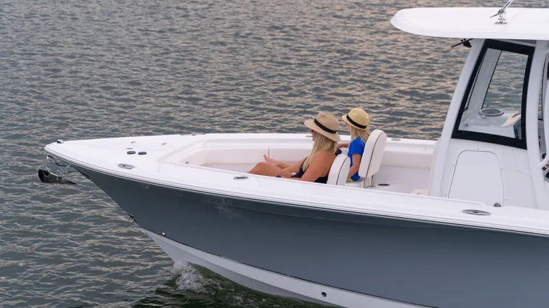Slide: The Image of 2025 Sea Hunt Gamefish 27 Forward Seating boat cruising with passengers. - 41