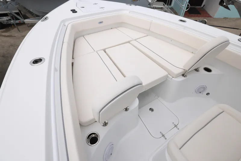 Slide: The Image of 2025 Sea Hunt Gamefish 27 Forward Seating, white cushioned bow seating area. - 5