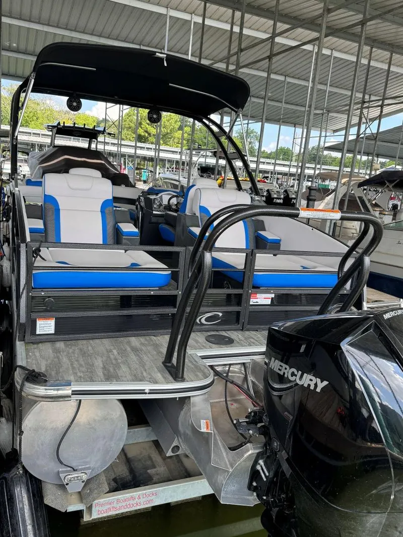 Slide: The Image of 2022 Crest Caribbean RS 250 SLRC pontoon boat with Mercury engine at dock. - 10