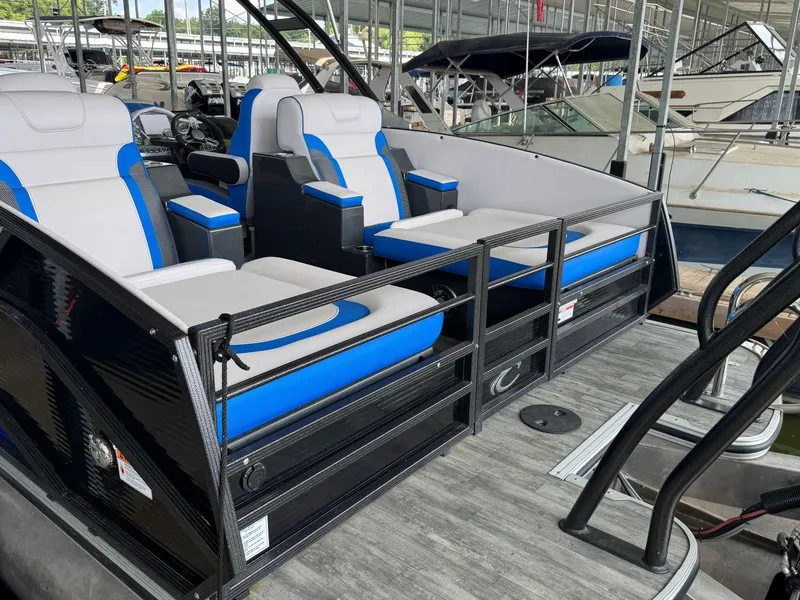 Slide: The Image of 2022 Crest Caribbean RS 250 SLRC boat interior with blue and white seating. - 11