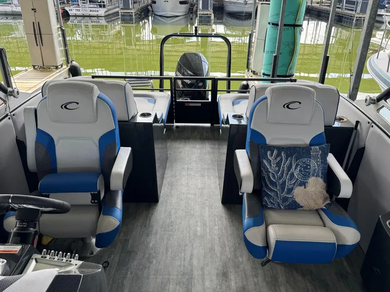 Slide: The Image of Interior of 2022 Crest Caribbean RS 250 SLRC boat with blue and gray seating. - 17