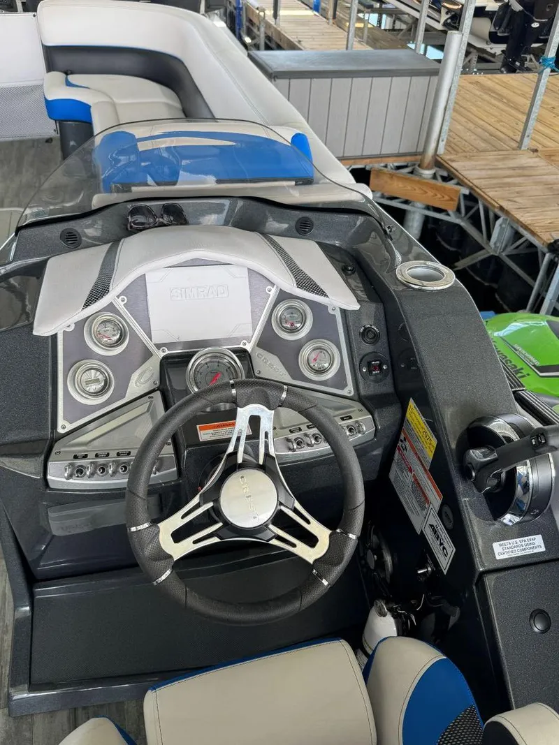 Slide: The Image of 2022 Crest Caribbean RS 250 SLRC boat dashboard with steering wheel and controls. - 20