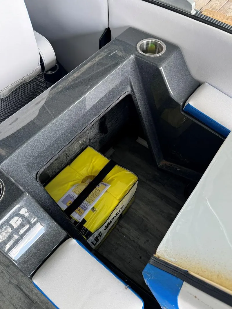 Slide: The Image of Interior of 2022 Crest Caribbean RS 250 SLRC with storage compartment and cup holder. - 30