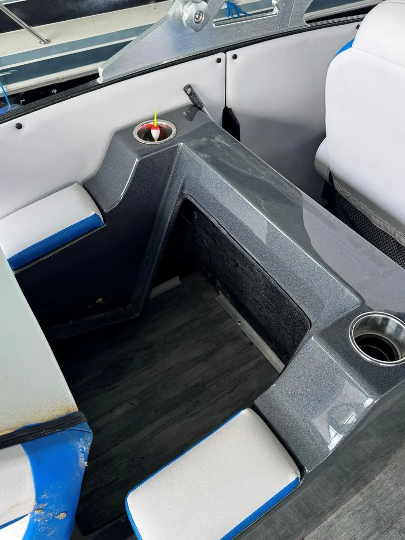 Slide: The Image of Interior of a 2022 Crest Caribbean RS 250 SLRC boat with cup holders and seating. - 31