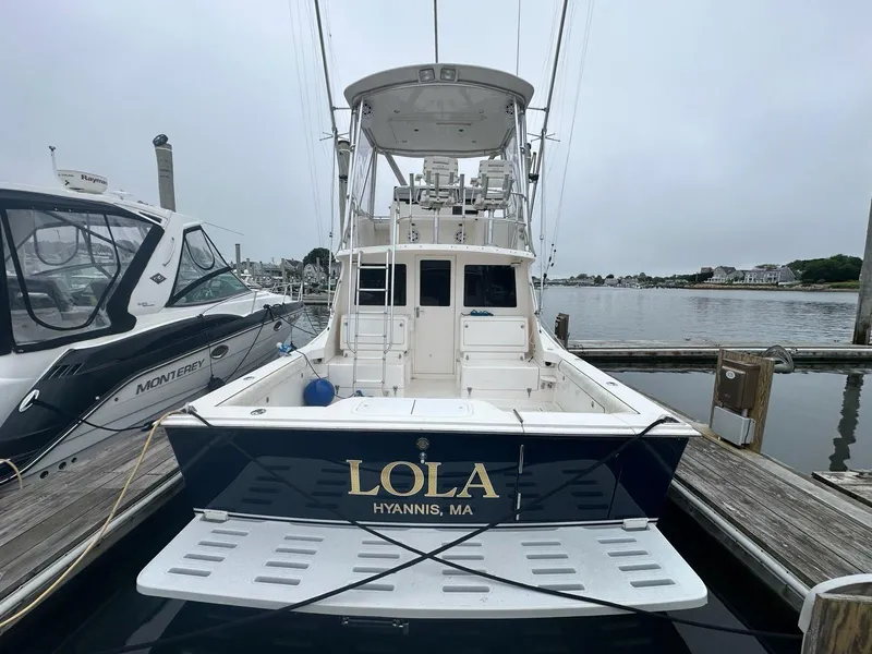 Slide: The Image of 2005 Cabo 35 Flybridge boat docked in Hyannis, MA. - 2