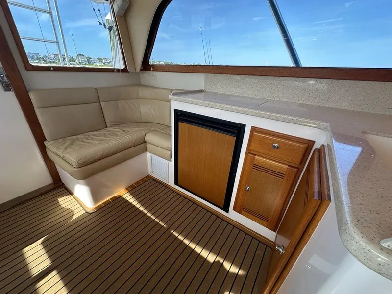 Slide: The Image of Interior of 2005 Cabo 35 Flybridge with seating and cabinetry. - 23