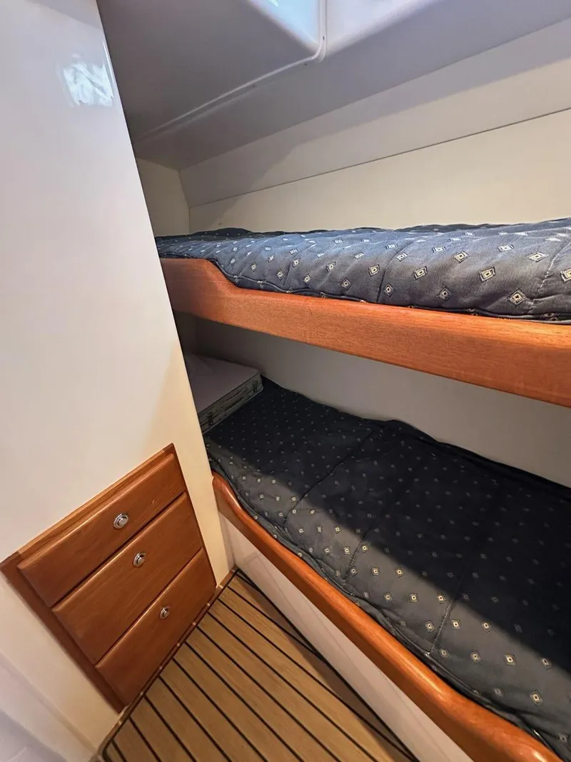 Slide: The Image of Interior of 2005 Cabo 35 Flybridge with bunk beds. - 24