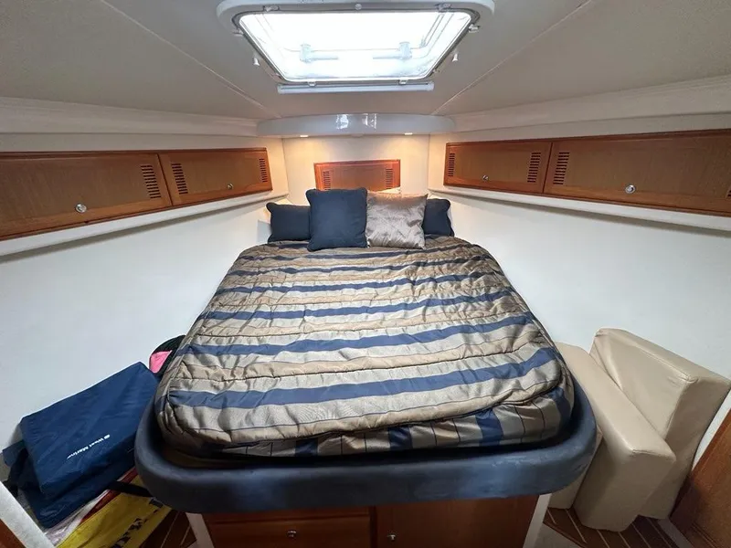 Slide: The Image of Interior of 2005 Cabo 35 Flybridge with cozy bed. - 27