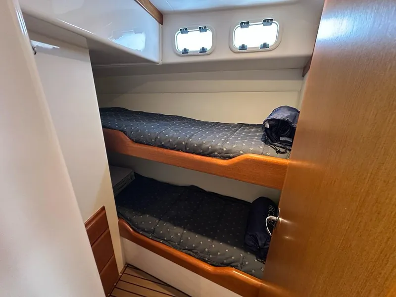 Slide: The Image of Interior of 2005 Cabo 35 Flybridge with bunk beds. - 31