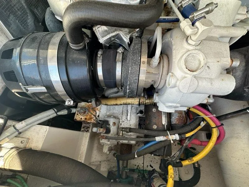 Slide: The Image of Engine compartment of a 2005 Cabo 35 Flybridge boat with hoses and cables. - 37
