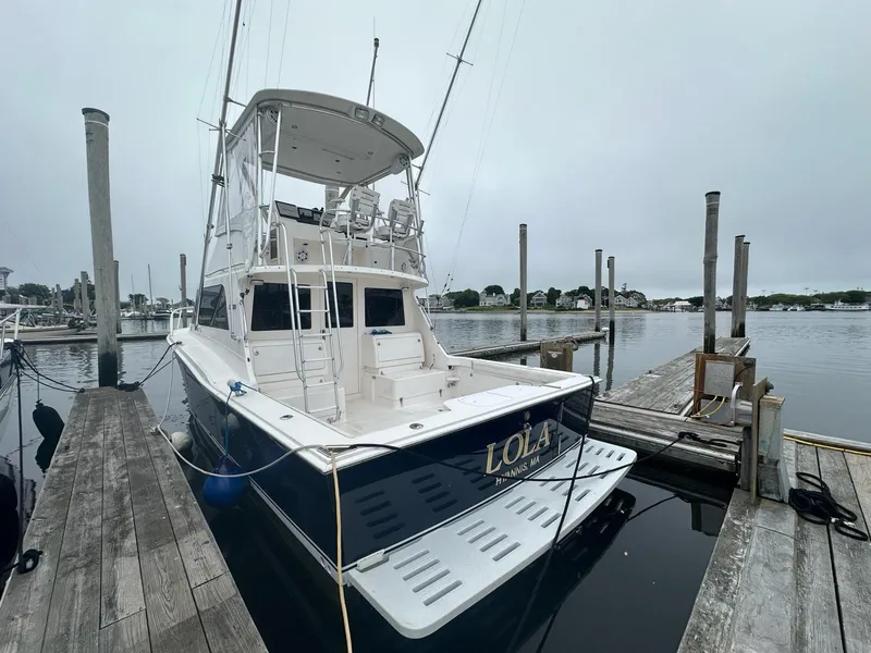 Slide: The Image of 2005 Cabo 35 Flybridge yacht docked at marina. - 4