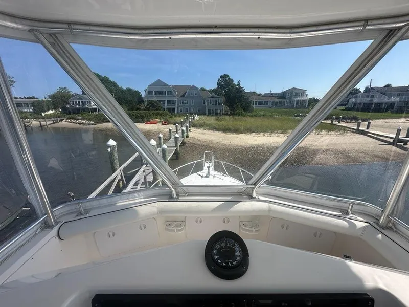 Slide: The Image of View from 2005 Cabo 35 Flybridge overlooking coastal homes. - 5