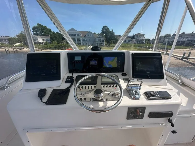 Slide: The Image of 2005 Cabo 35 Flybridge helm with modern electronics. - 7