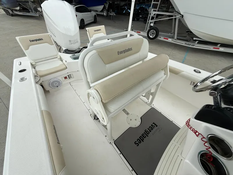 Slide: The Image of 2016 Everglades 243CC boat interior with seating and steering wheel. - 12