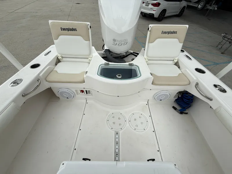 Slide: The Image of 2016 Everglades 243CC boat interior with seating and Yamaha 300 engine. - 13