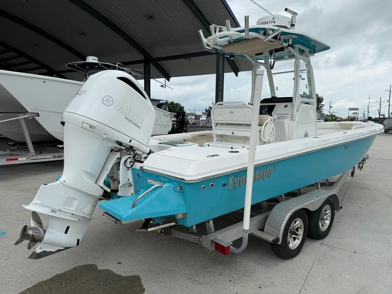 Slide: The Image of 2016 Everglades 243CC boat with Yamaha engine on trailer, parked outdoors. - 7