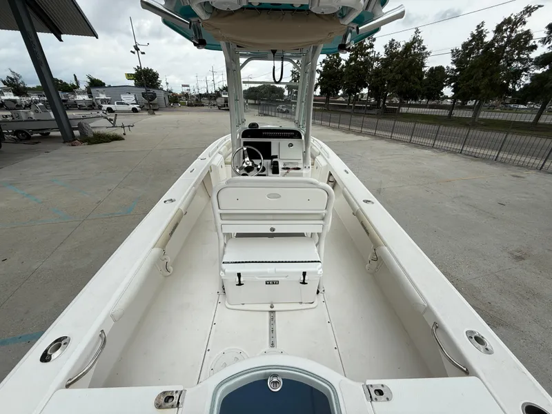 Slide: The Image of 2016 Everglades 243CC boat interior with seating and steering console. - 8