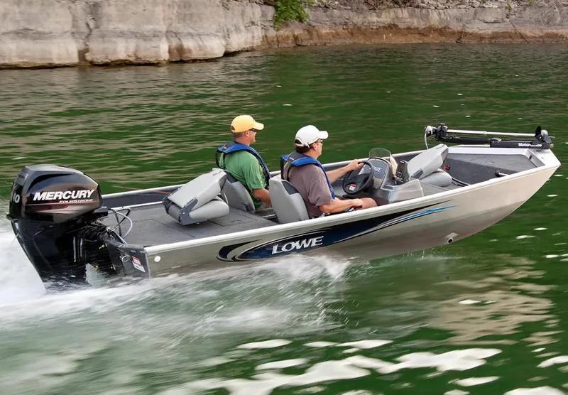 Slide: The Image of Manufacturer Provided Image: 2016 Lowe Stryker 16 boat cruising on a lake with two passengers. - 7