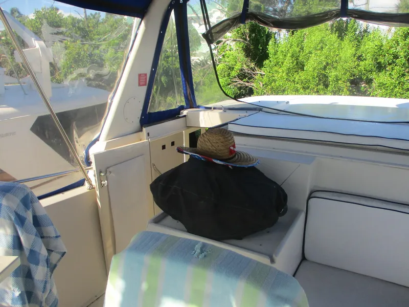 Slide: The Image of 1986 Hatteras 43 Double Cabin interior with sun hat and striped towel. - 21