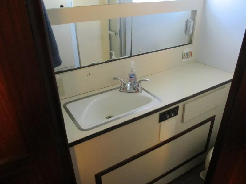 Slide: The Image of Bathroom sink area in 1986 Hatteras 43 Double Cabin yacht. - 26