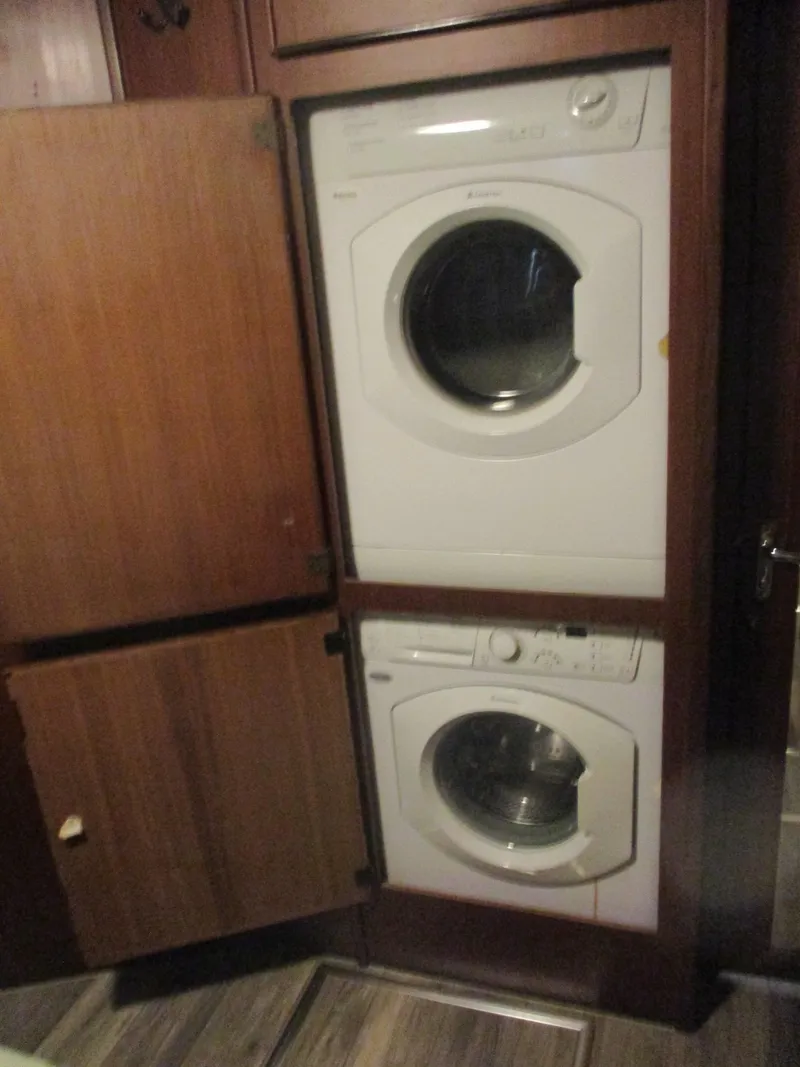 Slide: The Image of Stacked washer and dryer in 1986 Hatteras 43 Double Cabin yacht interior. - 29