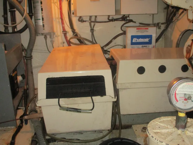 Slide: The Image of Engine room of 1986 Hatteras 43 Double Cabin with equipment and wiring. - 47
