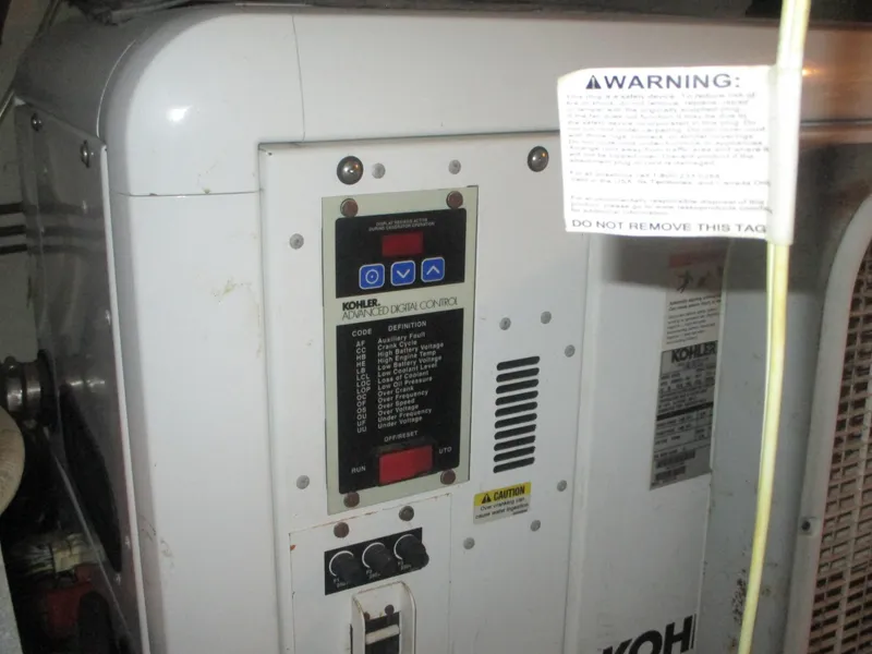 Slide: The Image of Kohler generator control panel on 1986 Hatteras 43 Double Cabin boat. - 48