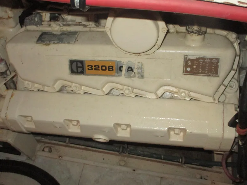 Slide: The Image of Engine of 1986 Hatteras 43 Double Cabin, featuring a 3208 model. - 49