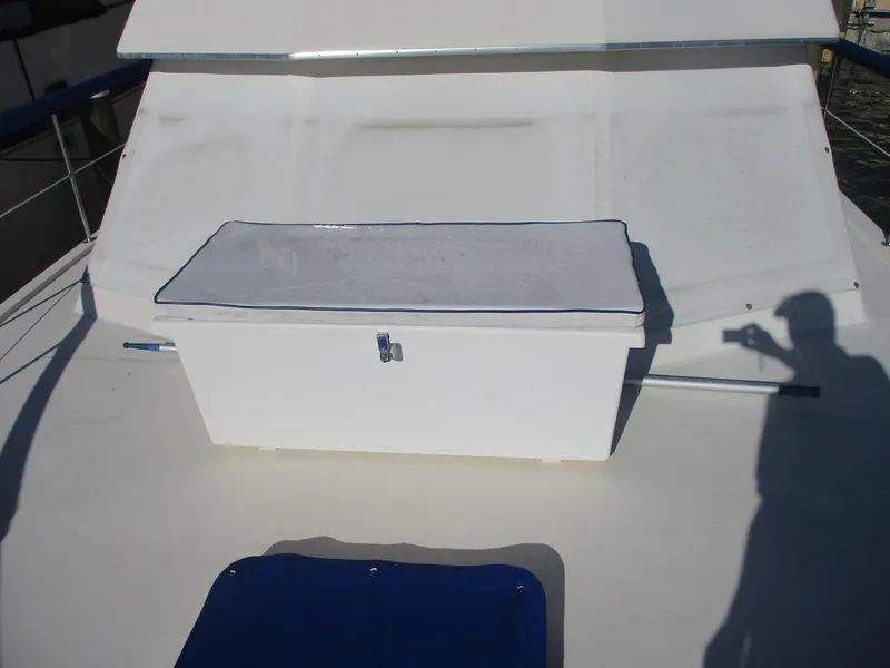 Slide: The Image of 1986 Hatteras 43 Double Cabin deck with storage box and shadow. - 9